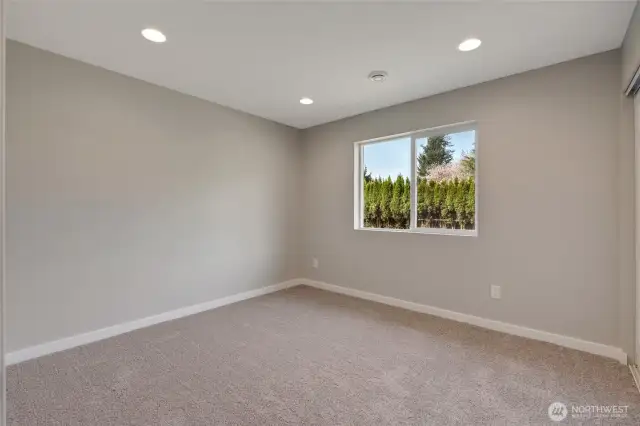 A flexible second bedroom, perfect for a home office or a peaceful retreat for guests.