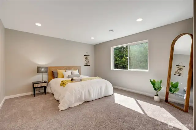 Relax in the spacious master bedroom, complete with an ensuite bathroom and a walk-in closet, designed for ultimate comfort and functionality.