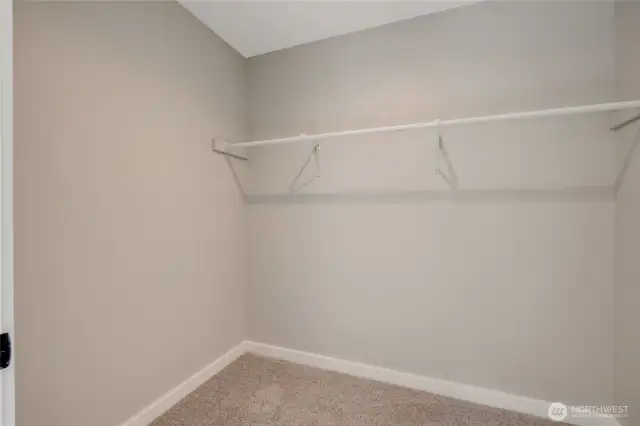 A walk-in closet with plenty of space, perfect for keeping your wardrobe organized and accessible.