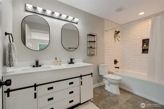 A luxurious ensuite bathroom with a double vanity, offering plenty of space and convenience for your daily routine.