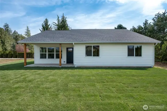 The backyard and covered patio offer the perfect setting for effortless outdoor enjoyment.