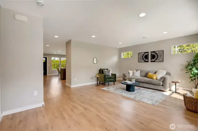 The living space flows effortlessly into the kitchen and dining area, creating an open, connected feel.