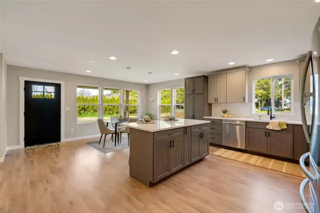 Enjoy casual meals at the kitchen island or more formal dining in the dedicated area.