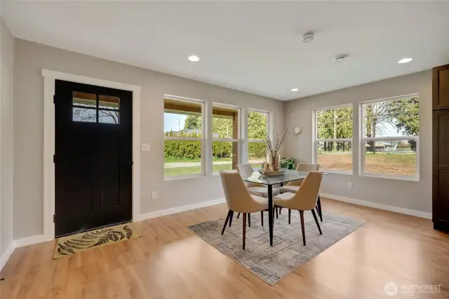 The dining area offers direct access to the covered back patio, perfect for indoor-outdoor living.