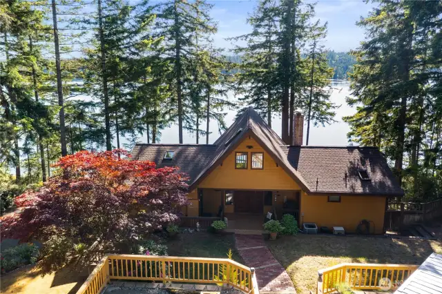 Front entrance features an easy maintenance lawn and beautiful landscape