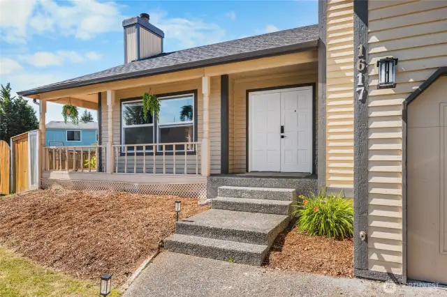 Freshly Painted French doors and a lovely wrap around porch leading all the way to the back deck.