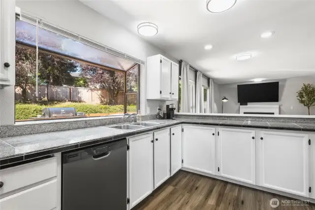 Large window behind the sink giving you a perfect view of the backyard.