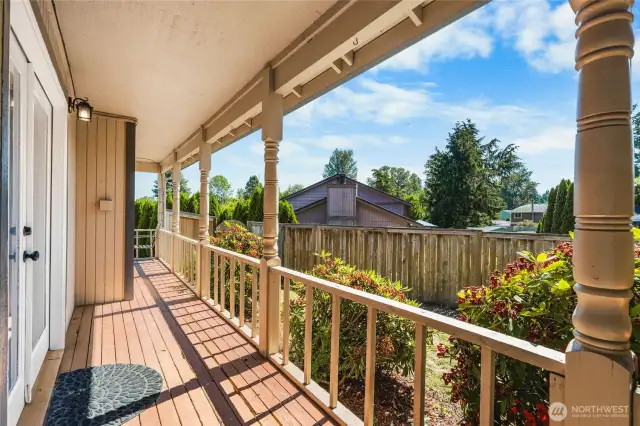 Wrap around porch leading to the front of the home.