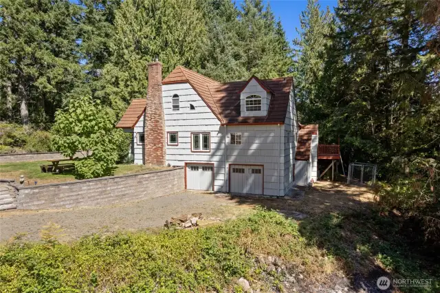 Gorgeous homestead complete with carriage doors to basement garage!