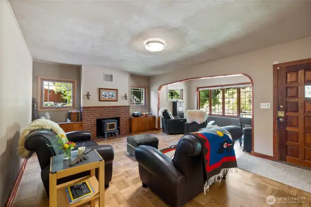 Enter the original structure and be greeted with a formal living room with wood burning fireplace!