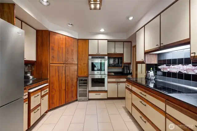 Don't overlook the breathtaking koa wood cabinetry sourced straight from Hawaii. The bookmatched surfaces are striking, to say the least.