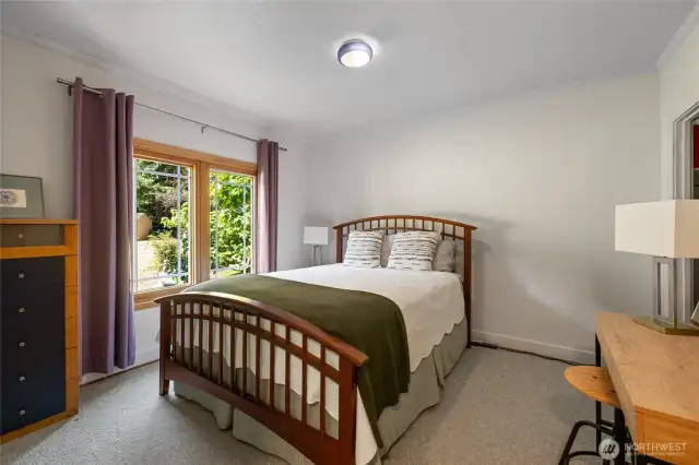 Bedroom #1 is off the main floor hallway and offers a large footprint with a view of the historic barn!