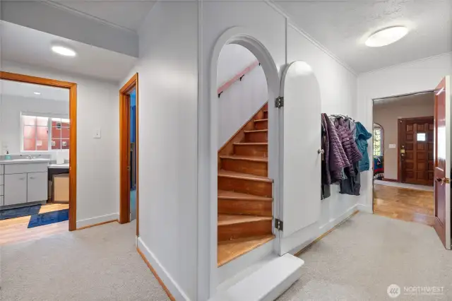 The classic arched doorway leads you with a handrail made from yew wood to the primary suite.