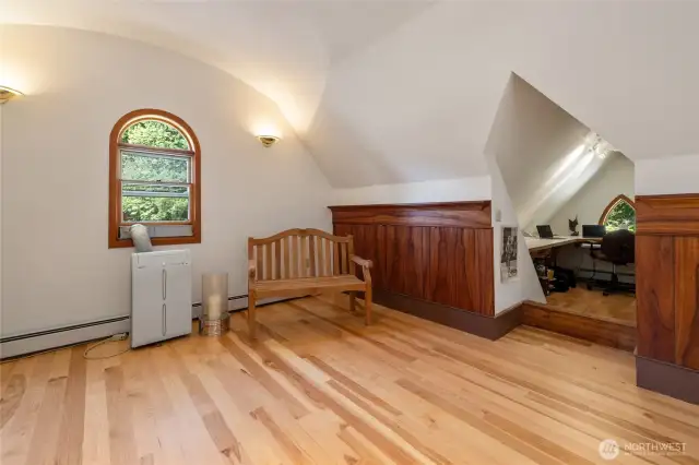Carpenter Gothic style is found in the pointed vault leading to the gabled office.