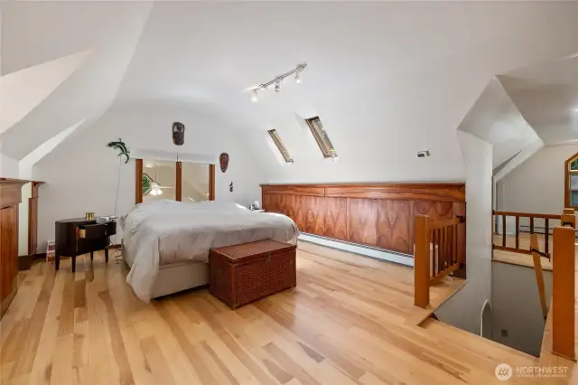 The rounded and pointed arches, windows in every direction, hickory floors and master woodworking throughout create a magical space.