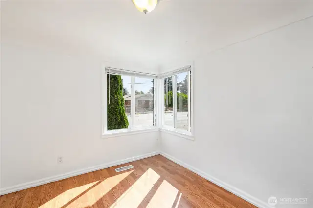 Separate dining room features corner windows that fills the space with natural light.