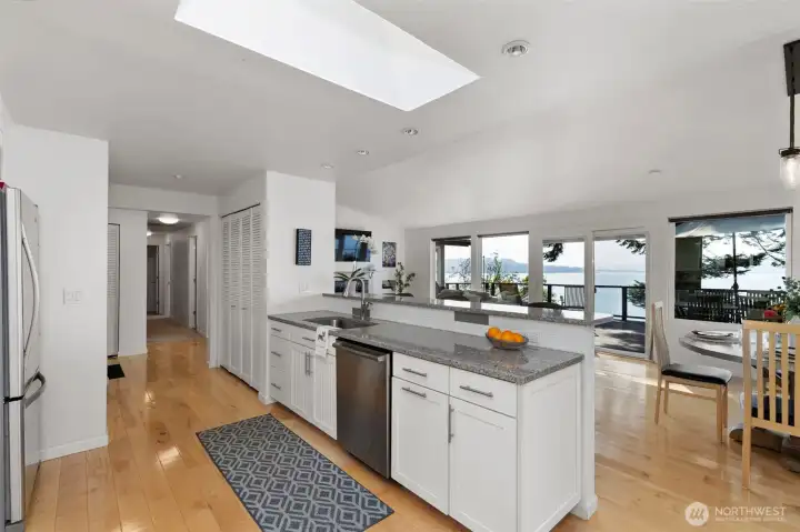 Kitchen looking into main level living room and VIEWS!