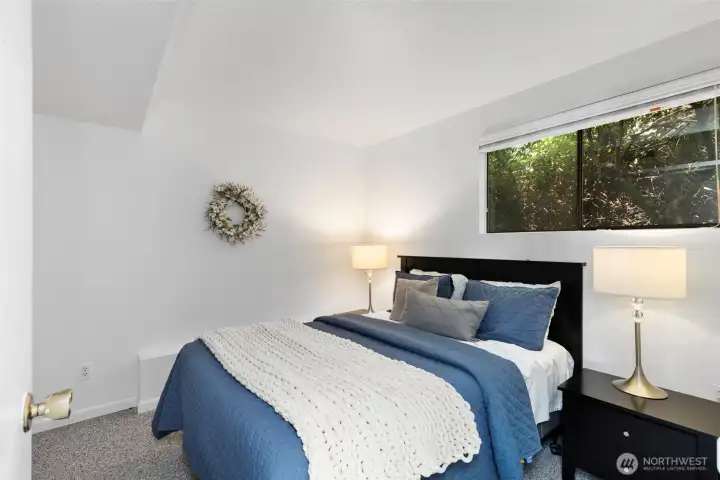 Lower level room with closet.