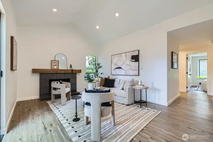 Bright & Spacious Living Looks Out onto Park-Like Courtyard & Cozy Fireplace