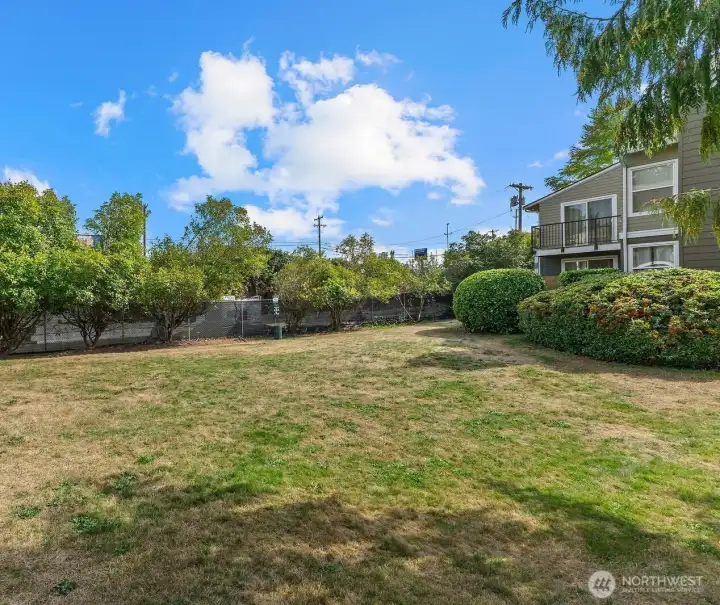 Grassy area outside of your patio. Great for walking with your pets.