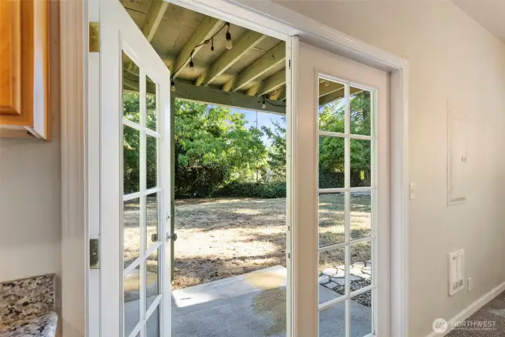 French doors off dining/kitchen areas leads to covered patio