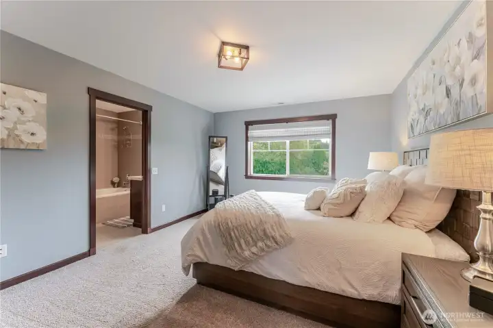 Serene primary bedroom (next to bedroom #1) with soft natural light, elegant finishes, and a private ensuite bath offering a peaceful retreat and effortless comfort at the end of each day