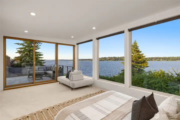 View from the primary bedroom. The primary   bedroom features new carpet, an oversized 5-bath suite, french doors, custom walk-in-closet and a slider out to the expansive deck.