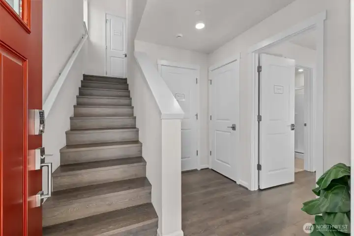 The foyer leads to a bedroom with an ensuite bath and convenient access to the garage.