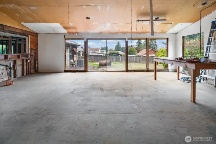 Huge light filled family room and dining room overlooking the patio and backyard.