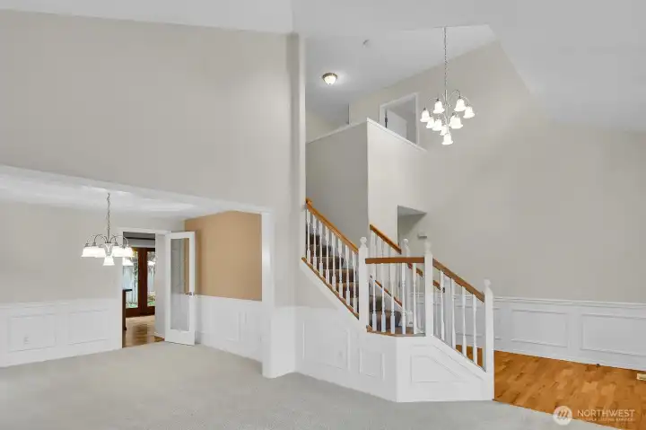 Entry leads to the living and dining rooms. Notice the architectural wainscoting!