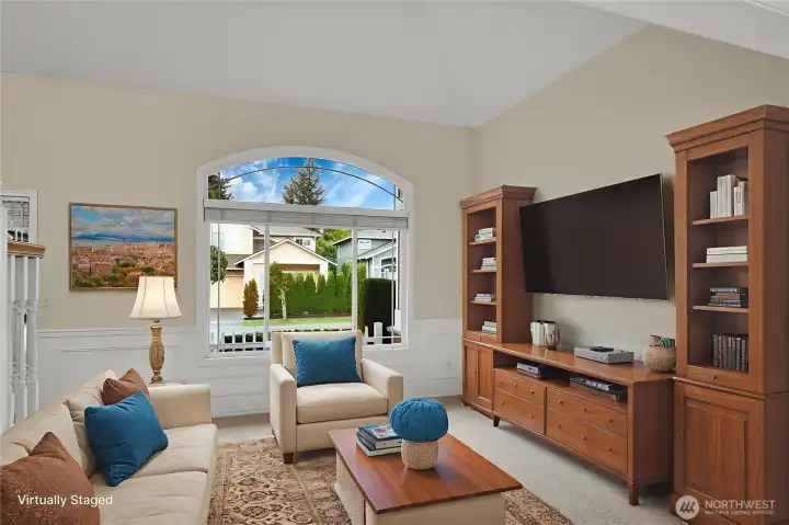 Virtually staged vaulted living room.