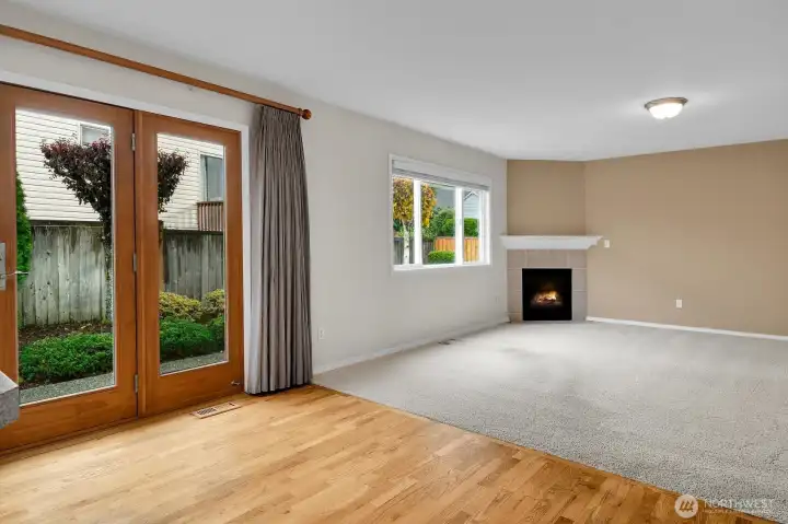 Kitchen is open to the family room. Doors lead to patio and landscaped backyard.