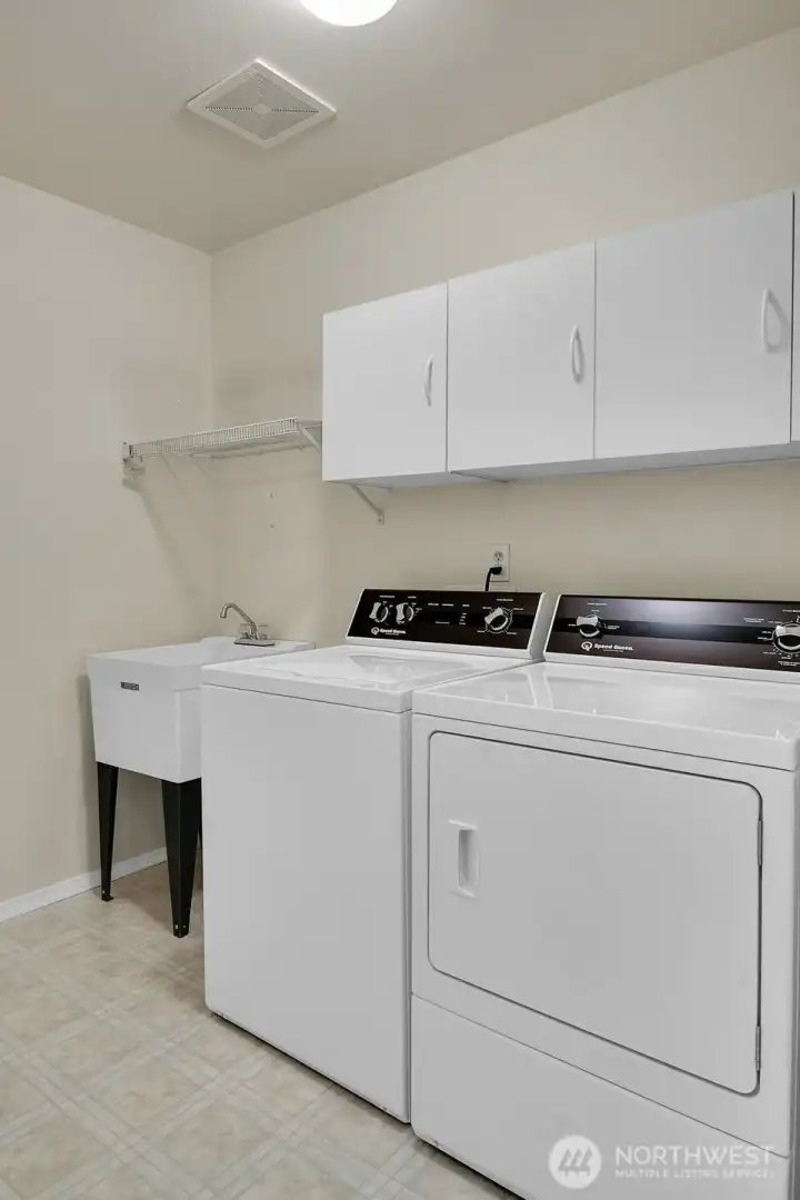 Laundry room with sink and storage! W/D stay.