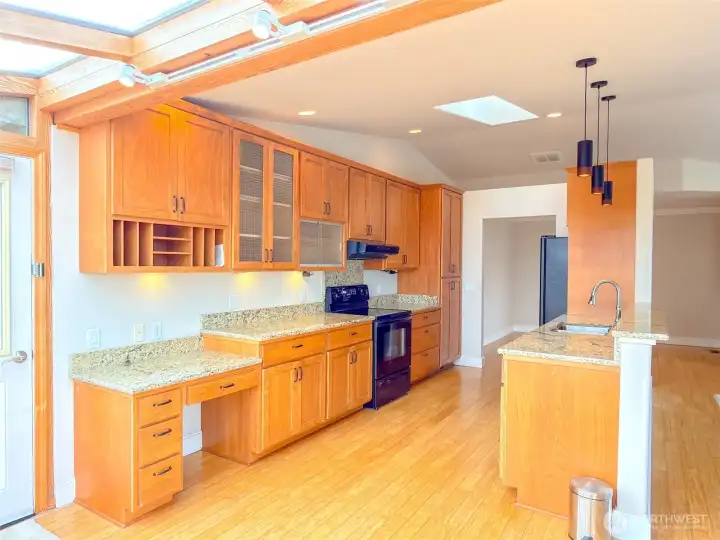 Very attractive and functional kitchen with gorgeous granite countertops and custom cabinetry.