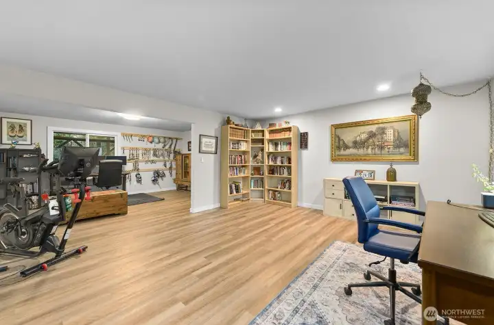 LVP flooring throughout this level enhances the natural light, creating a bright, inviting space perfect for gatherings and entertaining.