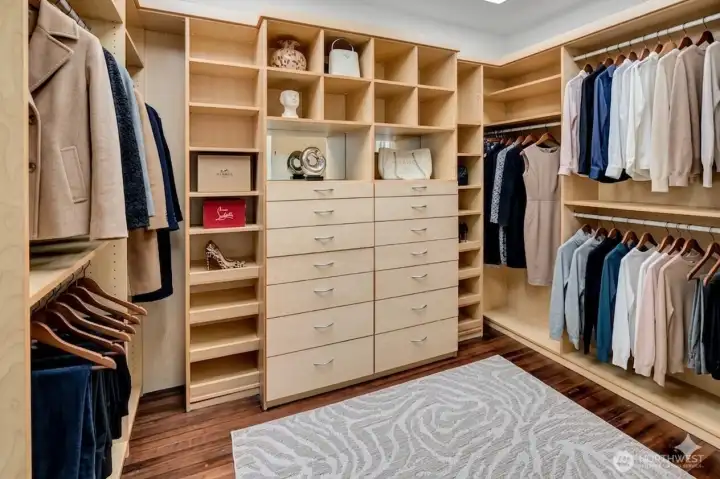 Generous Custom Closet with 2 Skylights