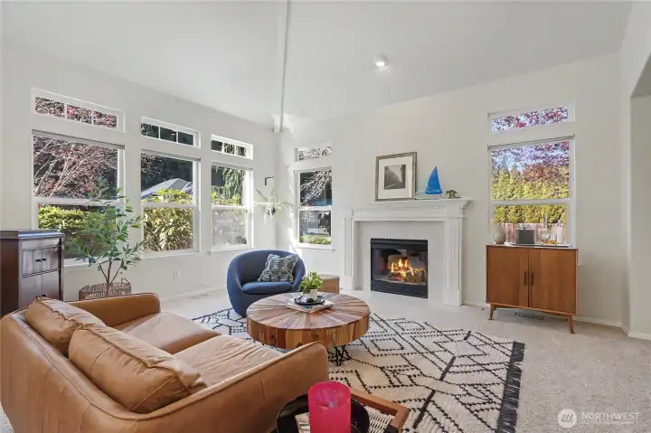 View of your formal living room at entry, I really love the vaulted ceilings and wall of windows that let in all the light. Your formal dining room is to your right.