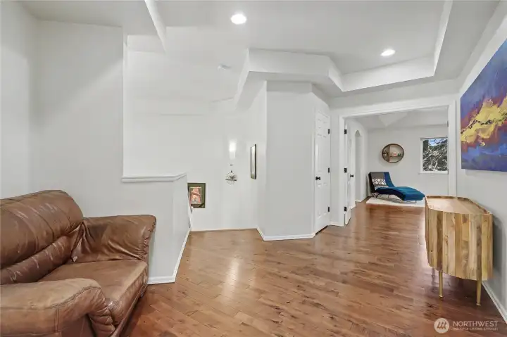 Upstairs landing shot, Sellers used it as a gaming center for their kids, primary suite straight ahead and note the beautiful ceilings and floors!