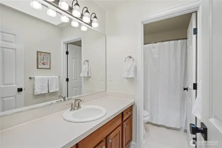 Full kids/guest bath with convenient separate shower/water closet space.