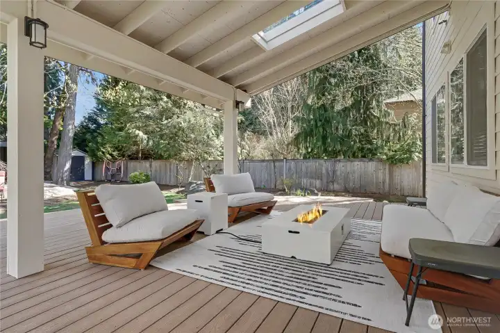 View of your outside large covered lanai with trex-like decking and skylights. Your backyard, as you shall see, is truly an oasis.