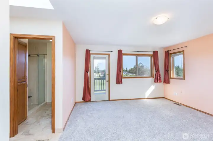 Primary bedroom with a deck! Primary bedroom with a deck!