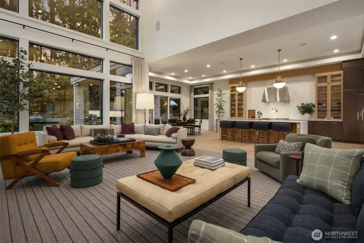 Dinner on the island, drinks in the great room, and the terrace just beyond the glass — the main floor was made for the kind of evening that starts at six and ends well past midnight.