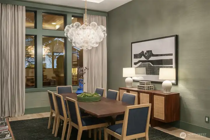 Wrapped in Thibaut Shang Fine Sisal with custom linen drapery and bespoke millwork valances — a room that makes dinner feel like an occasion every single time.