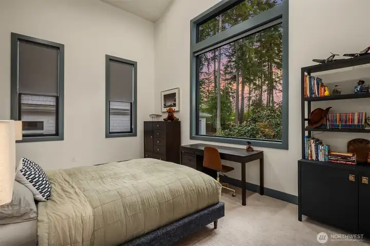 Towering evergreens, a sunset sky, and a room that makes bedtime a little easier to negotiate.