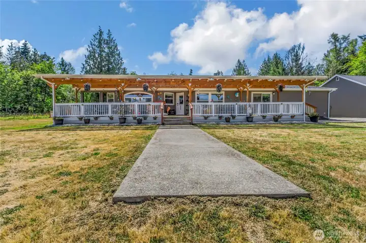 Back of the home shows the large covered deck Back of the home shows the large covered deck