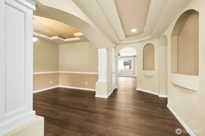 Entry hall opens up to display niches and large dining room w/tray ceilings and ambient lighting. Entry hall opens up to display niches and large dining room w/tray ceilings and ambient lighting.