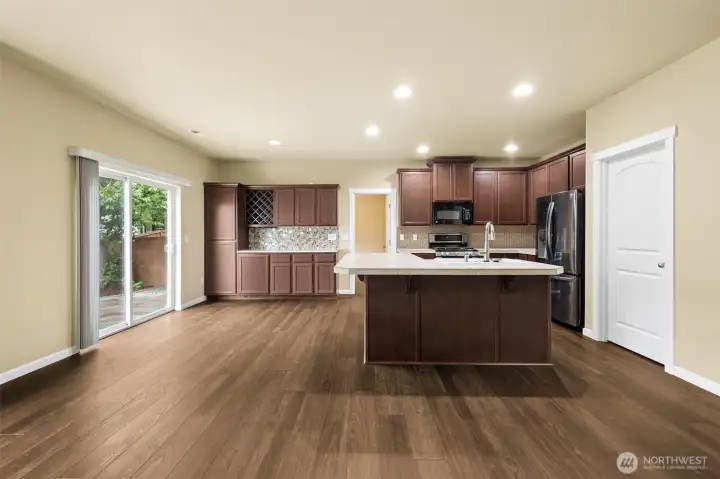 Large slider leads to back yard, engineered flooring and good sized island in the kitchen w/seating for 4-6 chairs. Large slider leads to back yard, engineered flooring and good sized island in the kitchen w/seating for 4-6 chairs.