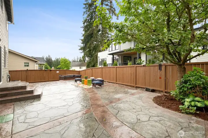 Back yard is completely finished with stamped concrete patio! Tons of room out here for dining table and seating area for all your summer enjoyment. Fully fenced as well. Hot tub works perfectly! Back yard is completely finished with stamped concrete patio! Tons of room out here for dining table and seating area for all your summer enjoyment. Fully fenced as well. Hot tub works perfectly!