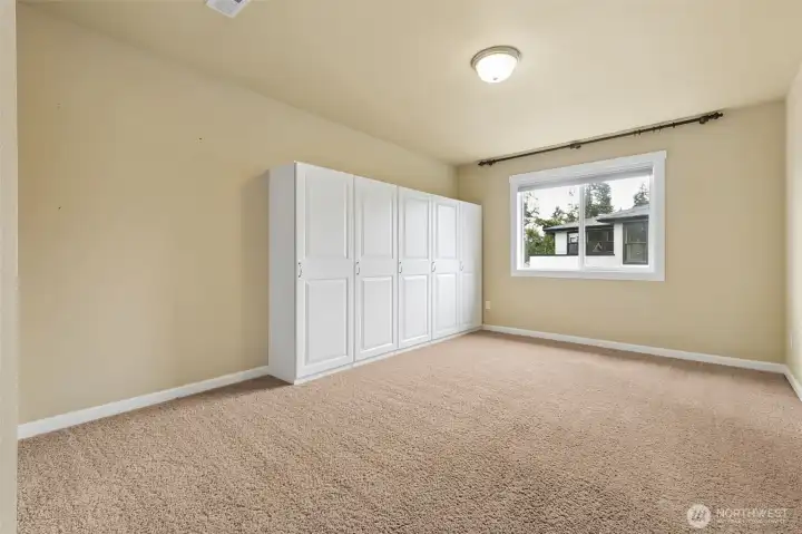 One of the 5 bedrooms on the upper level. One of the 5 bedrooms on the upper level.