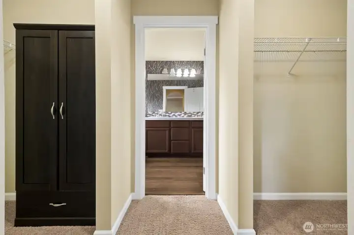 Two closets frame each side of the walk way into the bathroom. Two closets frame each side of the walk way into the bathroom.